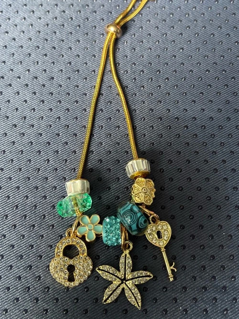 Gold-Tone Green Charm Bracelet with Locks and Starfish